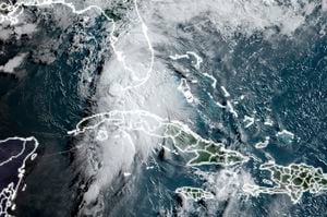 This National Oceanic and Atmospheric Administration (NOAA) satellite image taken at 12:00 UTC on July 6, 2021 shows Tropical Storm Elsa moving towards the US state of Florida after moving up from Cuba in the Caribbean. - Tropical storm Elsa was moving over the Florida Straits toward the southern US state Tuesday after battering Cuba with drenching rain and strong winds, but left the Caribbean island without major damage.The US National Hurricane Center reported the storm was now making its way towards the west coast of Florida at 12 miles (19 kilometers) per hour with "conditions beginning to deteriorate across" the Florida Keys, the archipelago at the state's southern tip.A hurricane watch has been issued "for portions of the west coast of Florida," the NHC said in its latest advisory at 5 am (0900 GMT). (Photo by Handout / NASA/NOAA / AFP) / RESTRICTED TO EDITORIAL USE - MANDATORY CREDIT "AFP PHOTO / NOAA/CIRA/RAMMB / HANDOUT " - NO MARKETING - NO ADVERTISING CAMPAIGNS - DISTRIBUTED AS A SERVICE TO CLIENTS
