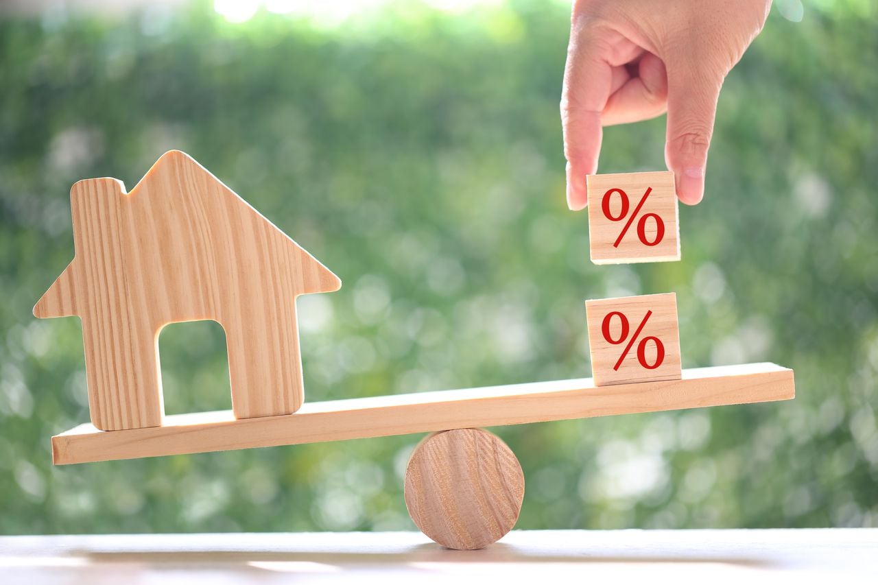 Estate tax,Model house with Percentage symbol icon on green background,Business investment and Property tax concept
