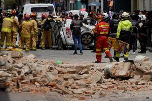 A damaged car and rubble from a house affected by the earthquake are pictured in Cuenca, Ecuador. March 18, 2023. REUTERS/Rafa Idrovo Espinoza NO RESALES. NO ARCHIVES