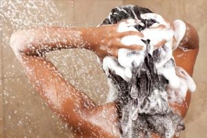 "Woman washing her hair with shampoo, rear view.Similar images preview:"