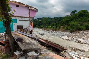A shop is completely damaged due to flash floods caused by heavy rains in the past few days in Dharmsala, India, Saturday, July 24, 2021. Heavy rains and fog continued to hit the mountain region on Saturday. (AP Photo/Ashwini Bhatia)