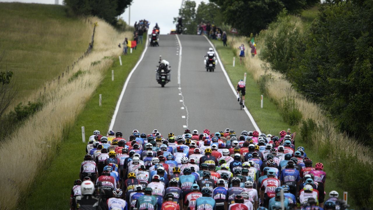 The pack rides during the sixth stage of the Tour de France cycling race over 220 kilometers (136.7 miles) with start in Binche and finish in Longwy, France, Thursday, July 7, 2022. (AP Photo/Daniel Cole)
