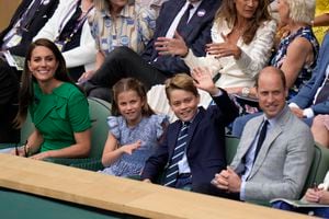 Kate, Princess of Wales, Princess Charlotte, Prince George and Britain's Prince William sit in the Royal Box on Centre Court for the final of the men's singles between Spain's Carlos Alcaraz and Serbia's Novak Djokovic on day fourteen of the Wimbledon tennis championships in London, Sunday, July 16, 2023. (AP Photo/Alastair Grant)