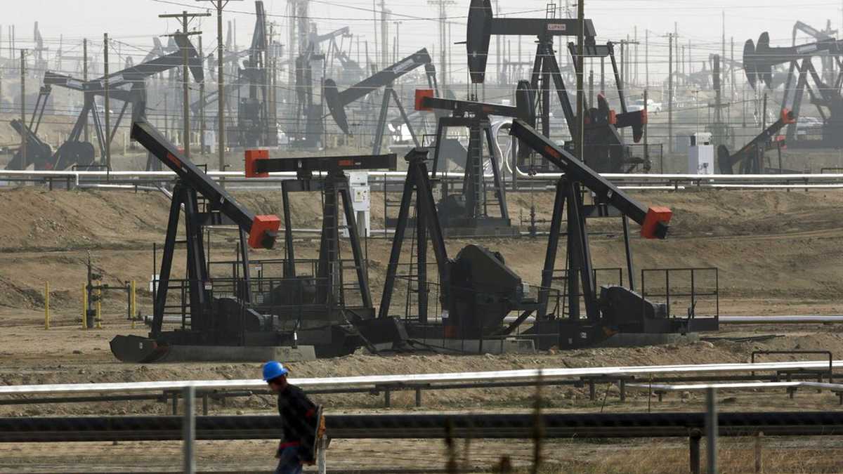 FILE - In this Jan. 16, 2015, file photo, pumpjacks are seen operating in Bakersfield, Calif. Last year, California Gov. Gavin Newsom called on the state Legislature to ban fracking by 2024. On Wednesday, Feb. 17, 2021, state Sen. Scott Wiener, a Democrat from San Francisco, introduced legislation that would ban the issuance or renewal of fracking permits starting on Jan. 1, 2022. The bill would also ban all fracking in California, along with other forms of oil extraction such as cyclic steaming, by Jan. 1, 2027. (AP Photo/Jae C. Hong, File)
