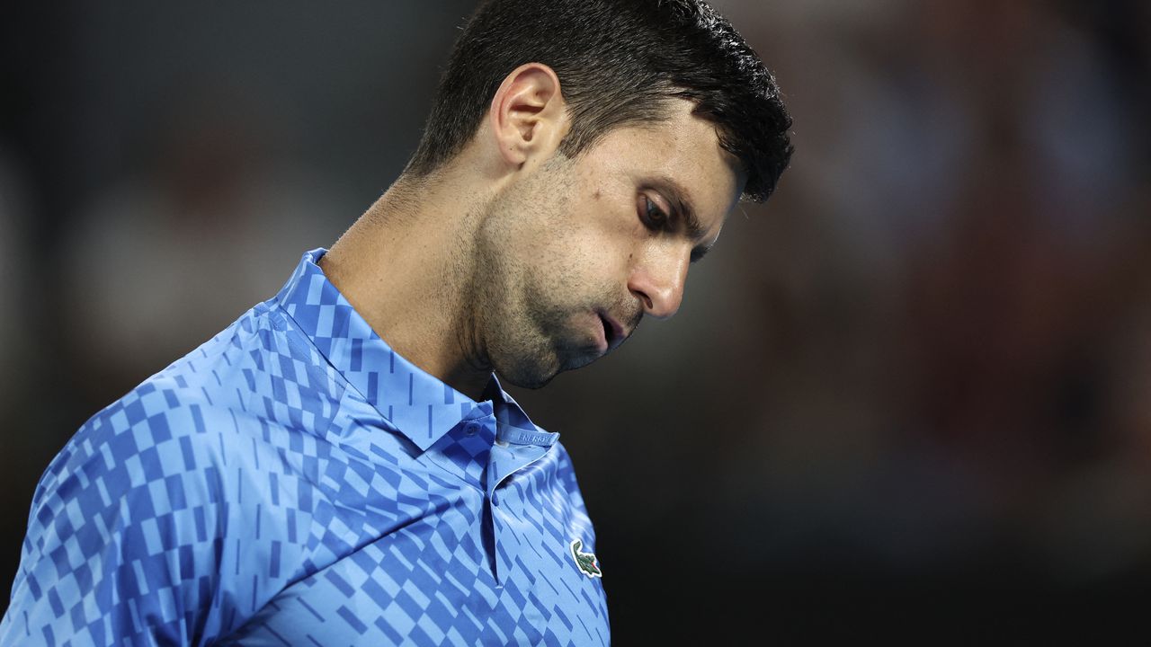 Serbia's Novak Djokovic reacts on a point against Spain's Roberto Carballes Baena during their men's singles match on day two of the Australian Open tennis tournament in Melbourne on January 17, 2023. (Photo by Martin KEEP / AFP) / -- IMAGE RESTRICTED TO EDITORIAL USE - STRICTLY NO COMMERCIAL USE --