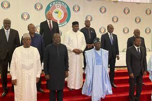 Nigeria President, Bola Ahmed Tinubu, second from left, poses , for a group photograph with other West Africa leaders after a meeting in Abuja Nigeria, Sunday, July 30, 2023. At an emergency meeting Sunday in Abuja, Nigeria, the West African bloc known as ECOWAS said that it was suspending relations with Niger, and authorized the use of force if President Mohamed Bazoum is not reinstated within a week. The African Union has issued a 15-day ultimatum to the junta in Niger to reinstall the democratically elected government. (AP Photo/Chinedu Asadu)