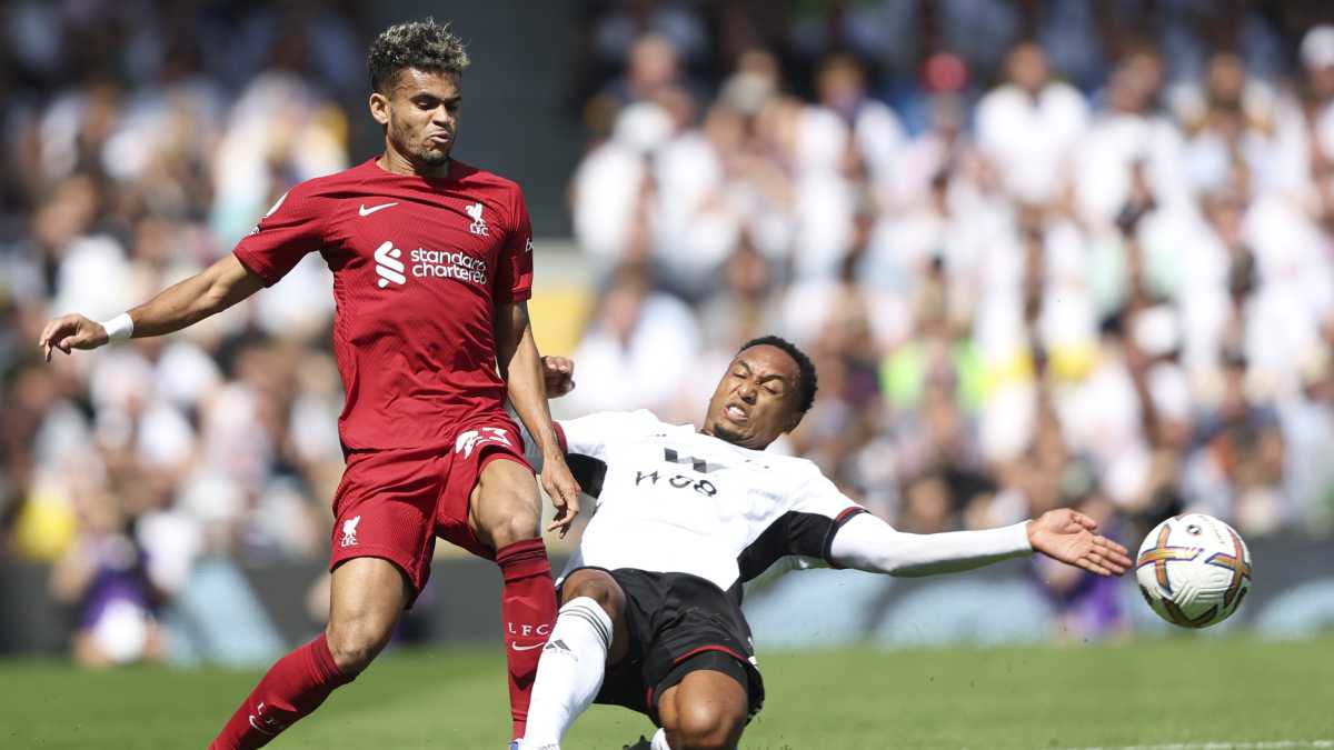 Liverpool's Luis Diaz, left, and Fulham's Kenny Tete vie for the ball during the English Premier League soccer match between Fulham and Liverpool at Craven Cottage stadium in London, Saturday, Aug. 6, 2022. (AP/Ian Walton)