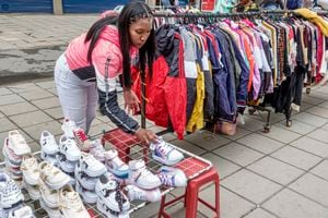 Bogota, Colombia, Plaza la Mariposa de San Victorino market, vendor selling activewear, jackets and athletic shoes. (Photo by: Jeffrey Greenberg/Universal Images Group via Getty Images)