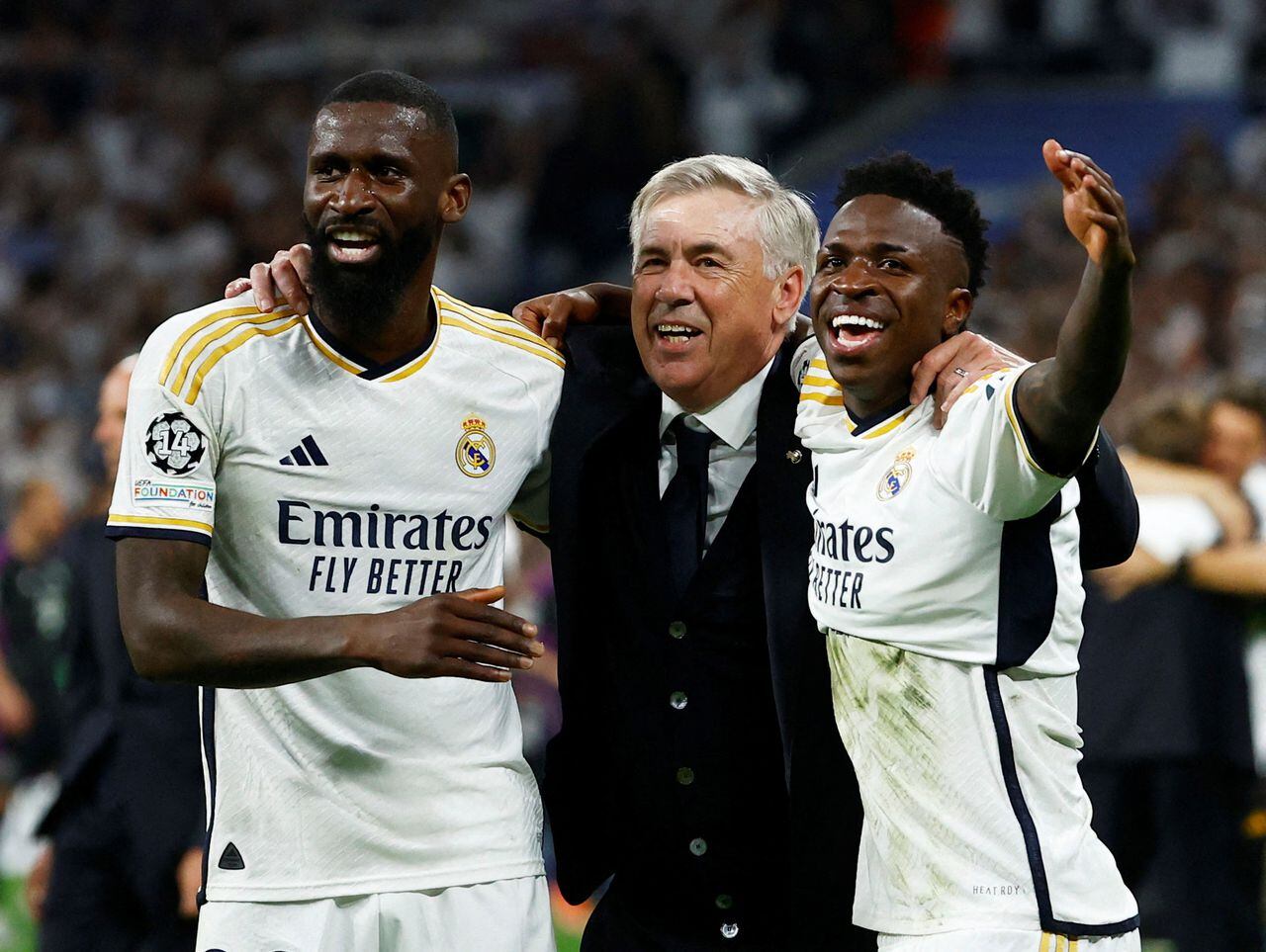 Soccer Football - Champions League - Semi Final - Second Leg - Real Madrid v Bayern Munich - Santiago Bernabeu, Madrid, Spain - May 8, 2024  Real Madrid's Antonio Rudiger, coach Carlo Ancelotti and Vinicius Junior celebrate after the match REUTERS/Susana Vera     TPX IMAGES OF THE DAY
