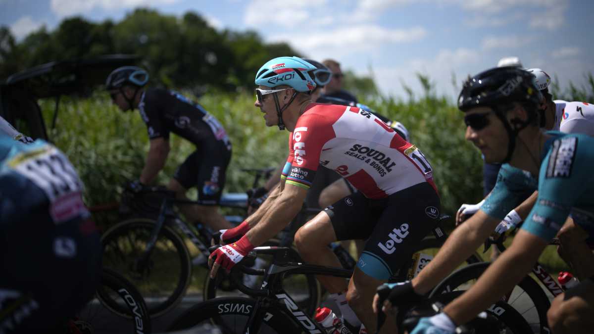 Belgium's Philippe Gilbert rides in the pack during the fourth stage of the Tour de France cycling race over 171.5 kilometers (106.6 miles) with start in Dunkerque and finish in Calais, France, Tuesday, July 5, 2022. (AP/Daniel Cole )