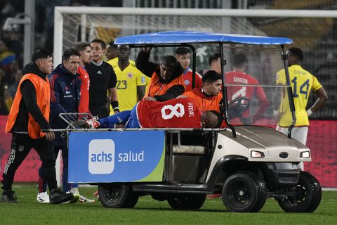 Chile's Arturo Vidal is taken out the field injured during a qualifying soccer match against Colombia for the FIFA World Cup 2026 at Monumental stadium in Santiago, Chile, Tuesday, Sept. 12, 2023. (AP Photo/Esteban Felix)