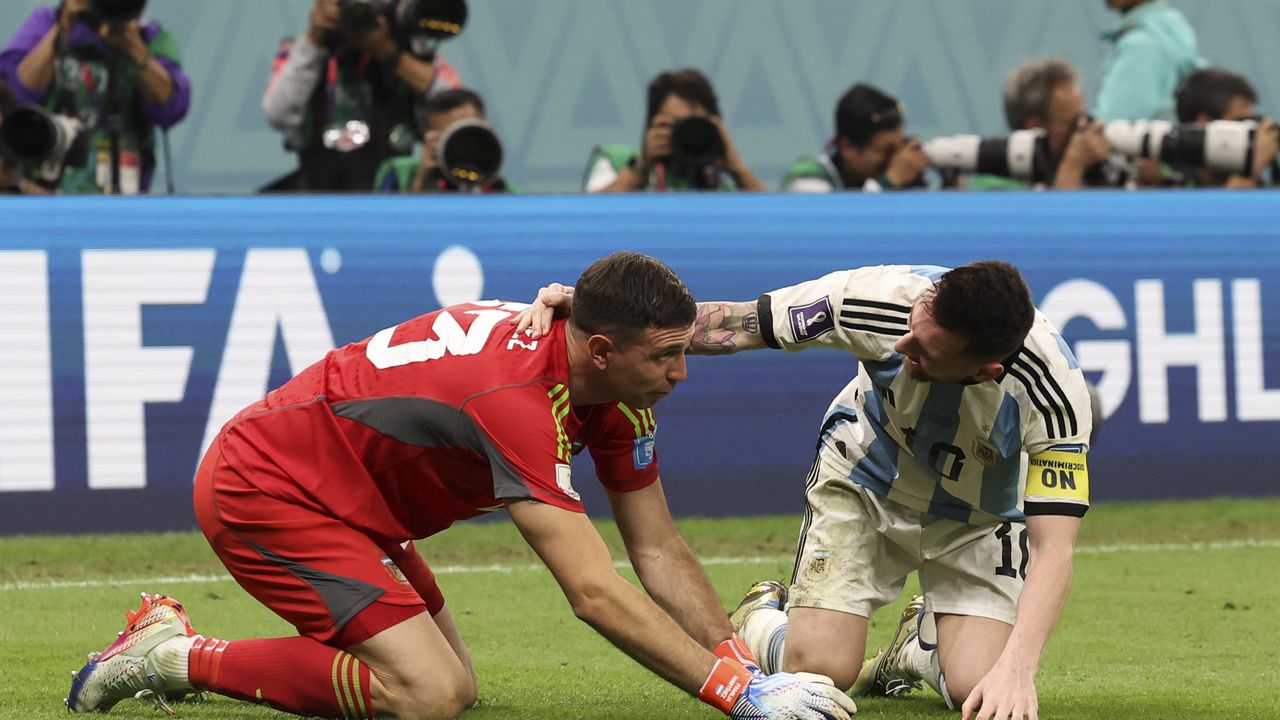 LUSAIL CITY, QATAR - DECEMBER 09: Lionel Messi of Argentina celebrates at full time with Emiliano Martínez of Argentina during the FIFA World Cup Qatar 2022 quarter final match between Netherlands and Argentina at Lusail Stadium on December 09, 2022 in Lusail City, Qatar. (Photo by Ian MacNicol/Getty Images)