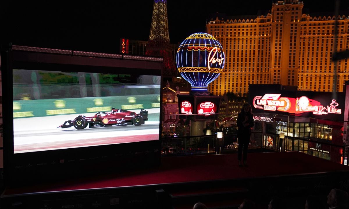 A screen show Charles Leclerc driving a Ferrari, during a news conference announcing a 2023 Formula One Grand Prix auto race to be held in Las Vegas, Wednesday, March 30, 2022, in Las Vegas. (AP/John Locher)