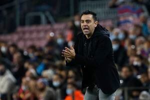 Barcelona's head coach Xavi Hernandez gives instructions from the side line during a Spanish La Liga soccer match between FC Barcelona and RCD Espanyol at the Camp Nou stadium in Barcelona, Spain, Saturday, Nov. 20, 2021. (AP Photo/Joan Monfort)