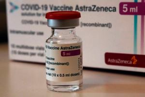 FILE - In this Monday, March 15, 2021 file photo a vial of AstraZeneca vaccine is pictured in a pharmacy in Boulogne Billancourt, outside Paris. At least a dozen countries including Germany, France, Italy and Spain have now temporarily suspended their use of AstraZeneca's coronavirus vaccine after reports last week that some people in Denmark and Norway who got a dose developed blood clots, even though there's no evidence that the shot was responsible. The European Medicines Agency and the World Health Organization say the data available don't suggest the vaccine caused the clots and that people should continue to be immunized. Here's a look at what we know — and what we don't.(AP Photo/Christophe Ena, File)