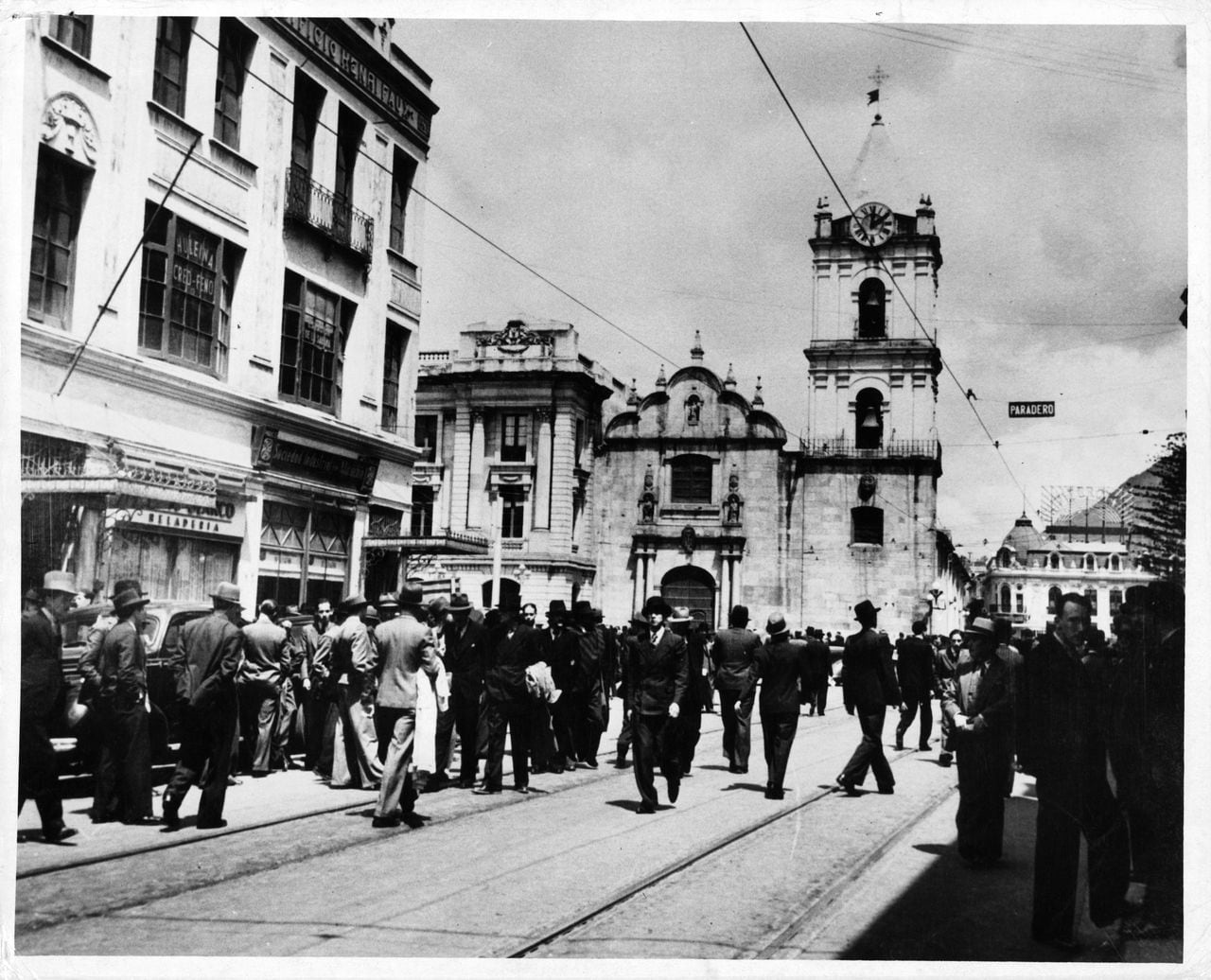 A view of men in suits walk the streets in Bogotá, Columbia. (Photo by Herbert/Archive Photos/Getty Images)