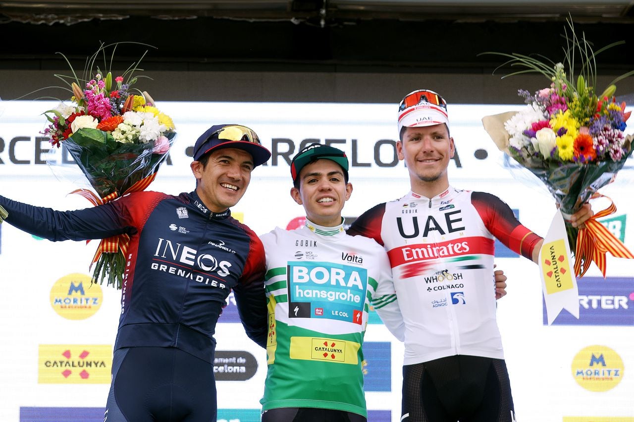 BARCELONA, SPAIN - MARCH 27: (L-R) Richard Carapaz of Ecuador and Team INEOS Grenadiers on second place, stage winner Sergio Andres Higuita Garcia of Colombia and Team Bora - Hansgrohe green leader jersey and João Almeida of Portugal and UAE Team Emirates on third place, pose on the podium during the podium ceremony after the 101st Volta Ciclista a Catalunya 2022 - Stage 7 a 138,7km stage from Barcelona to Barcelona / #VoltaCatalunya101 / #WorldTour / on March 27, 2022 in Barcelona, Spain. (Photo by Gonzalo Arroyo Moreno/Getty Images)