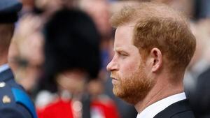 Britain's Prince Harry, Duke of Sussex, and Britain's William, Prince of Wales stand as the funeral procession marches down The Mall, on the day of the state funeral and burial of Britain's Queen Elizabeth, in London, Britain, September 19, 2022 REUTERS/Peter Cziborra