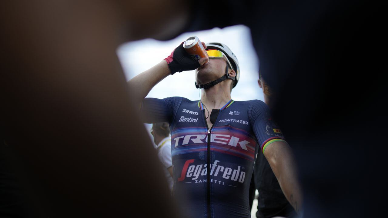 Stage winner Denmark's Mads Pedersen drinks after crossing the finish line of the thirteenth stage of the Tour de France cycling race over 193 kilometers (119.9 miles) with start in Le Bourg d'Oisans and finish in Saint-Etienne, France, Friday, July 15, 2022. (AP/Thibault Camus, Pool)