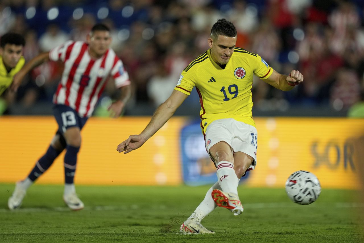 Colombia's Rafael Santos Borre scores from the penalty spot his side's opening goal against Paraguay in a qualifying soccer match for tColombia's Rafael Santos Borre scores from the penalty spot his side's opening goal against Paraguay in a qualifying soccer match for the FIFA World Cup 2026 at Defensores del Chaco stadium in Asuncion, Paraguay, Tuesday, Nov. 21, 2023. (AP Photo/Jorge Saenz)he FIFA World Cup 2026 at Defensores del Chaco stadium in Asuncion, Paraguay, Tuesday, Nov. 21, 2023. (AP Photo/Jorge Saenz)