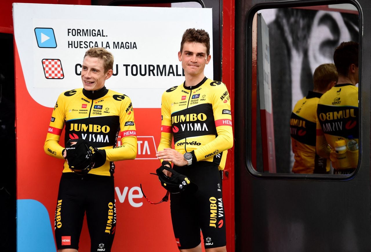 Overall leader of the race Team Jumbo-Visma's US rider Sepp Kuss and third placed Team Jumbo-Visma's Danish rider Jonas Vingegaard (L) celebrate on the podium after the stage 13 of the 2023 La Vuelta cycling tour of Spain, a 134,7 km race between Formigal and the Col du Tourmalet in France, on September 8, 2023. (Photo by ANDER GILLENEA / AFP)