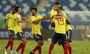 Colombia's Edwin Cardona, right, celebrates with teammates after scoring his side's opening goal against Ecuador during a Copa America soccer match at Arena Pantanal stadium in Cuiaba, Brazil, Sunday, June 13, 2021. (AP Photo/Bruna Prado)