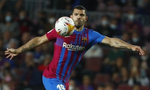 FILE - Barcelona's Sergio Aguero controls the ball during the Spanish La Liga soccer match between FC Barcelona and Valencia at the Camp Nou stadium in Barcelona, Spain, Oct. 17, 2021. Barcelona striker Sergio Aguero has on Wednesday, Dec. 15 announced his immediate retirement for health reasons. (AP Photo/Joan Monfort, file)
