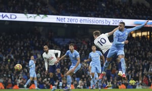 Tottenham's Harry Kane, second right, scores his side's third goal during the English Premier League soccer match between Manchester City and Tottenham Hotspur, at the Etihad stadium in Manchester, England, Saturday, Feb. 19, 2022. (AP Photo/Jon Super)