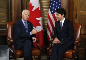 FILE - In this Dec. 9, 2016 file photo, Canadian Prime Minister Justin Trudeau meets with then U.S. Vice President Joe Biden on Parliament Hill in Ottawa. Biden will still host Canadian Prime Minister Justin Trudeau on Tuesday for the first bilateral meeting but will do it virtually. (Patrick Doyle/The Canadian Press via AP)