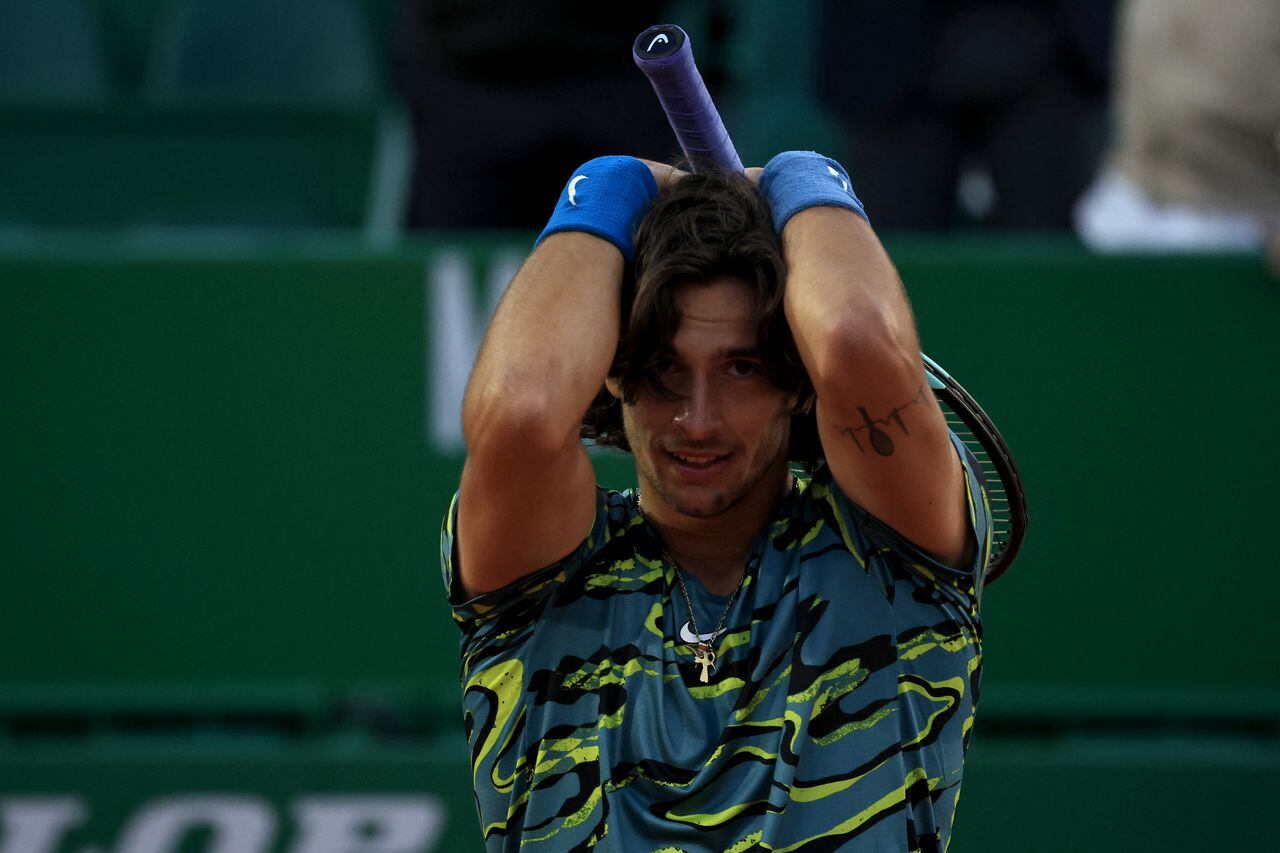 Italy's Lorenzo Musetti reacts after beating Serbia's Novak Djokovic at the Monte-Carlo ATP Masters Series tournament round of 16 tennis match in Monte Carlo on April 13, 2023. (Photo by Valery HACHE / AFP)