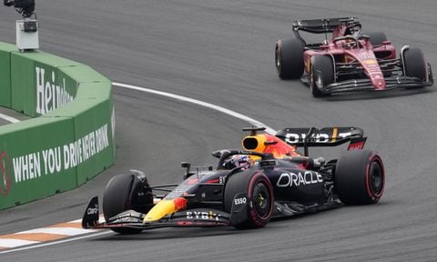 Red Bull driver Max Verstappen of the Netherlands leads Ferrari driver Charles Leclerc of Monaco, right, during the Formula One Dutch Grand Prix auto race, at the Zandvoort racetrack, in Zandvoort, Netherlands, Sunday, Sept. 4, 2022. (AP/Peter Dejong)