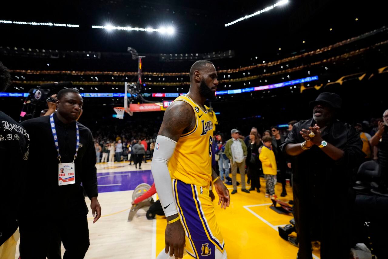 Los Angeles Lakers forward LeBron James walks off the court after a loss to the Denver Nuggets in Game 4 of the NBA basketball Western Conference Final series Monday, May 22, 2023, in Los Angeles. (AP Photo/Ashley Landis)