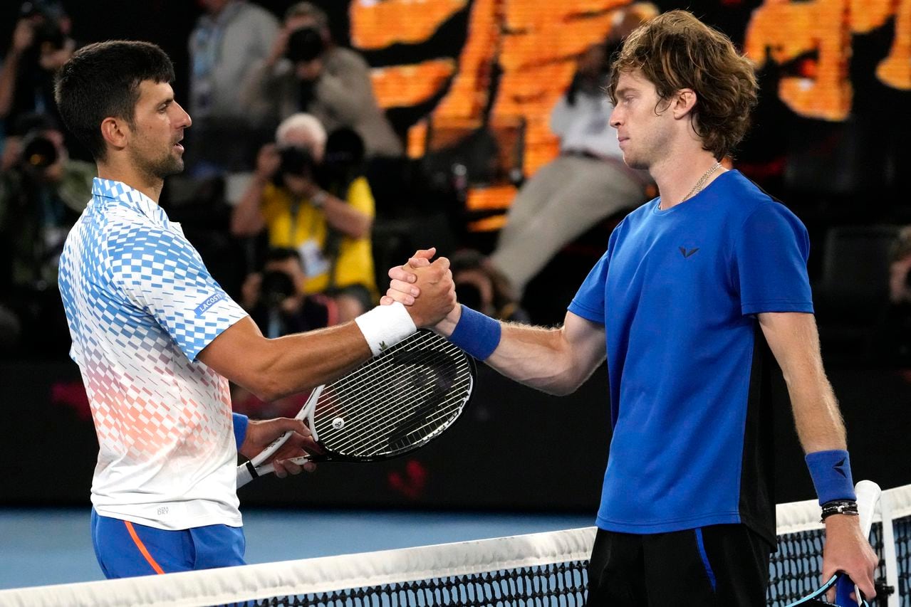 Novak Djokovic, left, of Serbia is congratulated by Andrey Rublev of Russia following their quarterfinal match at the Australian Open tennis championship in Melbourne, Australia, Wednesday, Jan. 25, 2023. (AP Photo/Ng Han Guan)