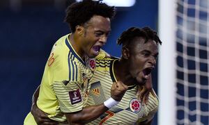 BARRANQUILLA, COLOMBIA - OCTOBER 09: Duván Zapata of Colombia celebrates after scoring the first goal of his team with teammate Juan Cuadrado during a match between Colombia and Venezuela as part of South American Qualifiers for Qatar 2022 at Estadio Metropolitano on October 09, 2020 in Barranquilla, Colombia. (Photo by Gabriel Aponte/Getty Images)