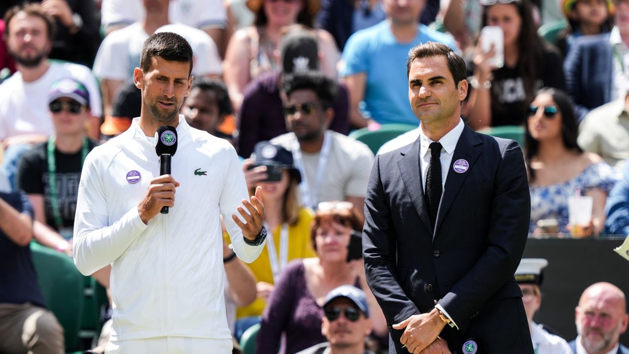 LONDON, ENGLAND - JULY 03: Novak Djokovic (L) of Serbia and Roger Federer of Switzerland attend the Centre Court Centenary Celebration during day seven of The Championships Wimbledon 2022 at All England Lawn Tennis and Croquet Club on July 03, 2022 in London, England. (Photo by Shi Tang/Getty Images)