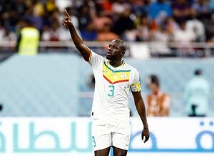 Soccer Football - FIFA World Cup Qatar 2022 - Group A - Ecuador v Senegal - Khalifa International Stadium, Doha, Qatar - November 29, 2022  Senegal's Kalidou Koulibaly celebrates scoring their second goal REUTERS/Stephane Mahe