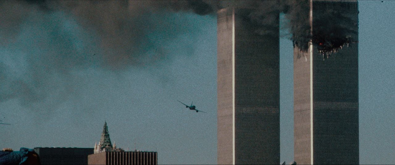 Turning Point: 9/11 and the War on Terror- A shot of the second hijacked airplane just seconds before it strikes the second tower from episode THE SYSTEM WAS BLINKING RED, Season 1 of Turning Point: 9/11 and the War on Terror. Credit: Courtesy of NETFLIX / ©NETFLIX 2021