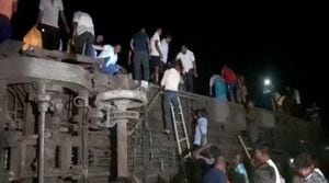 People try to escape from toppled compartments, following the deadly collision of two trains, in Balasore, India June 2, 2023, in this screen grab obtained from a video. ANI/Reuters TV via REUTERS THIS IMAGE HAS BEEN SUPPLIED BY A THIRD PARTY. NO RESALES. NO ARCHIVES INDIA OUT. NO COMMERCIAL OR EDITORIAL SALES IN INDIA
