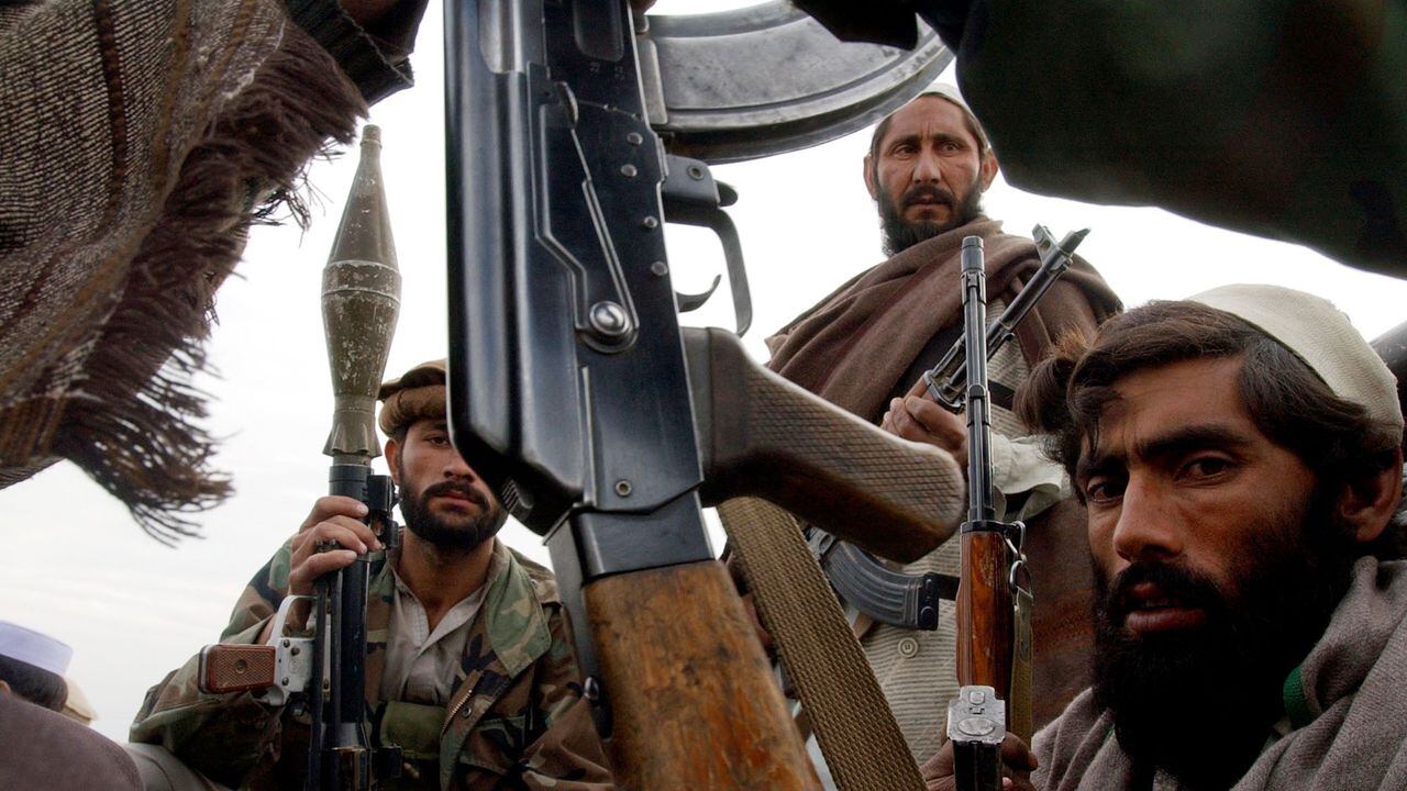 A group of Anti-Taliban fighters sit in the back of a pick-up truck as they wait to join in the pursuit of the remaining Taliban and al-Qaeda fighters. The Alliance has captured Tora Bora and some Taliban fighters, 19 of which were displayed later in the day. The remaining Taliban are said to have fled into the hills. (Craig F Walker/The Denver Post)  (Photo By Craig F. Walker/The Denver Post via Getty Images)