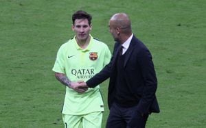 MUNICH, GERMANY - MAY 12:  Team coach Josep Guardiola (R) of Bayern Muenchen shakes hands with Lionel Messi of FC Barcelona during half-time of the UEFA Champions League semi final second leg match between FC Bayern Muenchen and FC Barcelona at Allianz Arena on May 12, 2015 in Munich, Germany.  (Photo by A. Beier/FC Bayern via Getty Images)