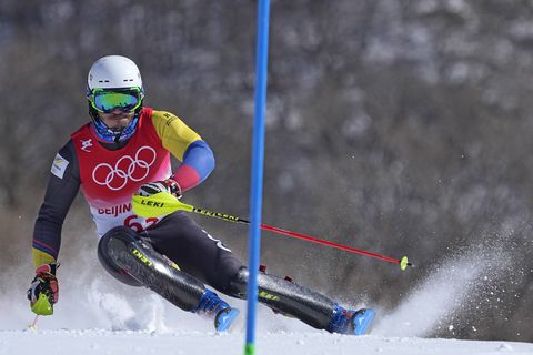 Michael Poettoz, of Colombia passes a gate during the first run of the men's slalom at the 2022 Winter Olympics, Wednesday, Feb. 16, 2022, in the Yanqing district of Beijing. (AP Photo/Robert F. Bukaty)