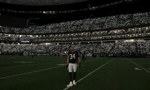 LAS VEGAS, NEVADA - JANUARY 09: Outside linebacker K.J. Wright #34 of the Las Vegas Raiders stands on the field as fans turn their cell phone lights on on during a tribute to former Raiders head coach, Pro Football Hall of Fame member and broadcaster John Madden before a game between the Los Angeles Chargers and the Las Vegas Raiders at Allegiant Stadium on January 9, 2022 in Las Vegas, Nevada. Madden, who coached the Oakland Raiders for 10 seasons and won the team's first championship with a win over the Minnesota Vikings in Super Bowl XI in 1977, died on December 28 2021, at the age of 85. The Raiders defeated the Chargers 35-32 in overtime. (Photo by Ethan Miller/Getty Images)