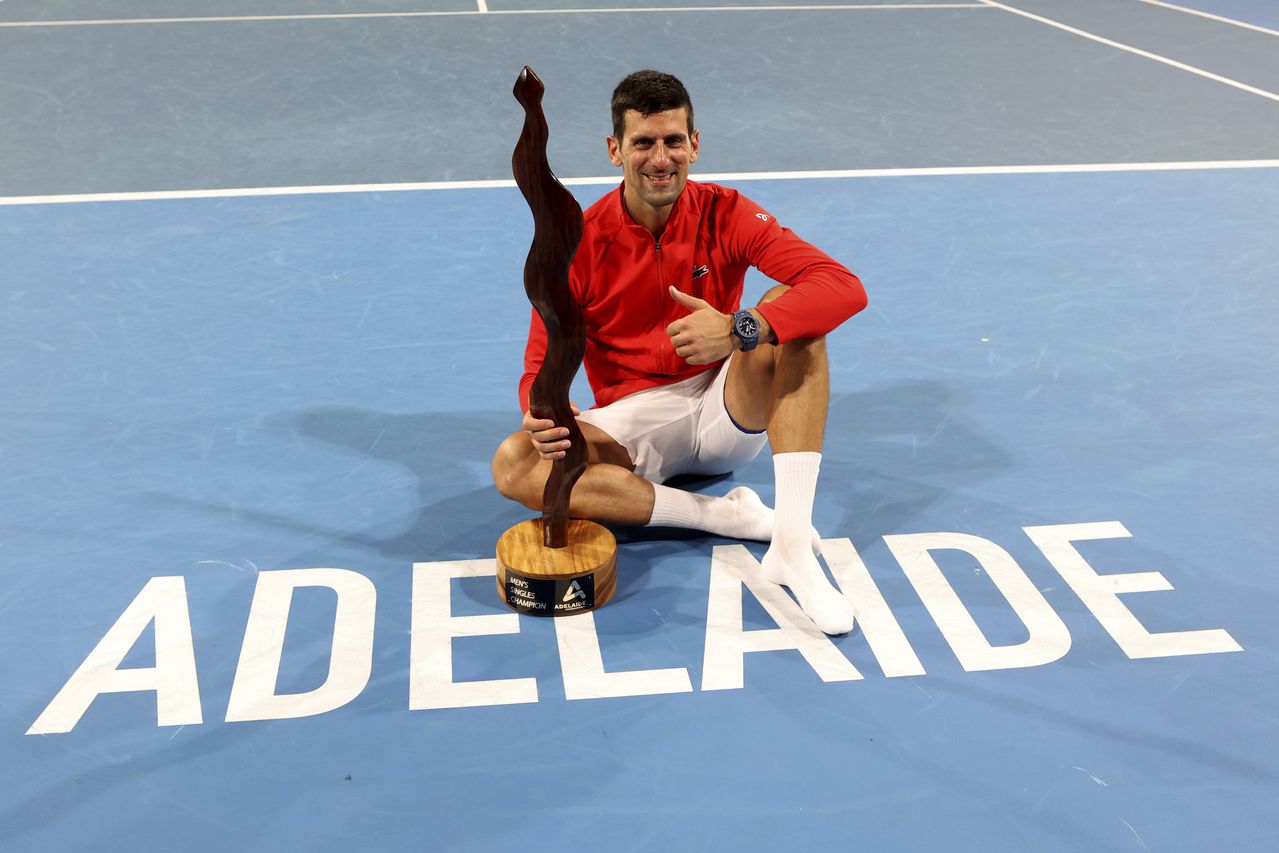 Serbia's Novak Djokovic celebrates winning the final of the Adelaide International tennis tournament against USA's Sebastian Korda in Adelaide, Australia, Sunday, Jan. 8, 2023. (AP Photo/Kelly Barnes)