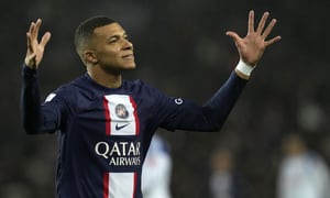PSG's Kylian Mbappe reacts after missing a chance to score during the French League One soccer match between Paris Saint-Germain and Strasbourg at the Parc des Princes in Paris, Wednesday, Dec. 28, 2022. (AP Photo/Thibault Camus)