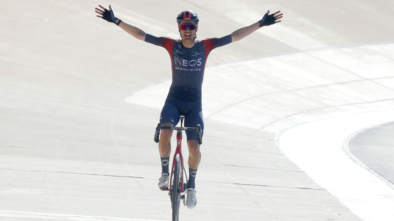 Netherland's Dylan Van Baarle celebrates as he crosses the finish line to win the Paris-Roubaix cycling race, a 257 kilometer (160 mile) one-day-race at the velodrome in Roubaix, northern France, Sunday, April 17, 2022. (AP/Michel Spingler)