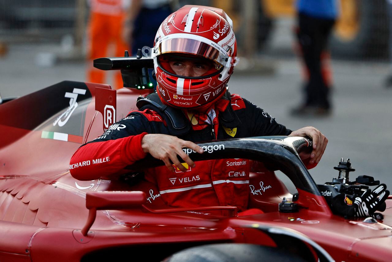 Ferrari's Monegasque driver Charles Leclerc celebrates after claiming pole position in the qualifying session for the Formula One Azerbaijan Grand Prix at the Baku City Circuit in Baku on June 11, 2022. (Photo by HAMAD I MOHAMMED / POOL / AFP)