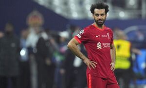 Liverpool's Mohamed Salah reacts after the Champions League final soccer match between Liverpool and Real Madrid at the Stade de France in Saint Denis near Paris, Saturday, May 28, 2022. Real won 1-0. (AP Photo/Petr David Josek)
