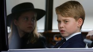 Britain's Prince George and Princess Charlotte sit in a car on the day of the state funeral and burial of Britain's Queen Elizabeth, at Westminster Abbey, in London, Britain, September 19, 2022. REUTERS/Sarah Meyssonnier/Pool