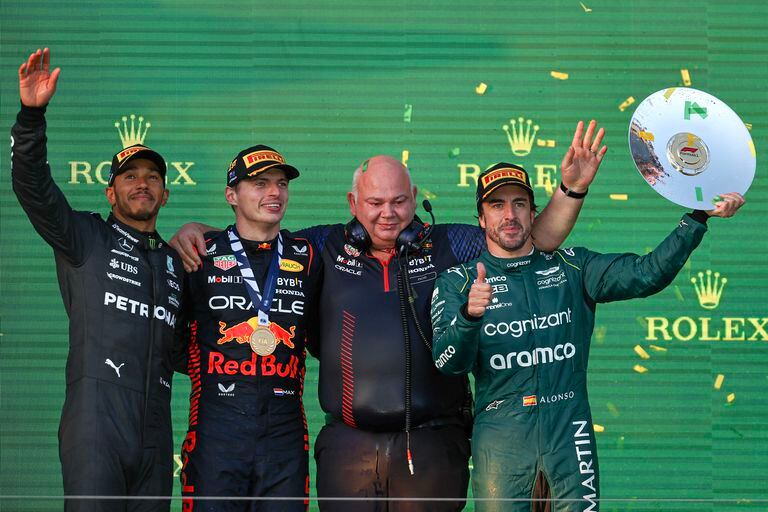 MELBOURNE, AUSTRALIA - APRIL 02: (L-R) Lewis Hamilton of Great Britain and Mercedes-AMG PETRONAS F1 Team, Max Verstappen of the Netherlands and Oracle Red Bull Racing, Rob Marshall of Great Britain and Oracle Red Bull Racing and Fernando Alonso of Spain and Aston Martin Aramco Cognizant F1 Team celebrate on the podium during the F1 Grand Prix of Australia at Melbourne Grand Prix Circuit on April 2, 2023 in Melbourne, Australia. (Photo by Qian Jun/MB Media/Getty Images)