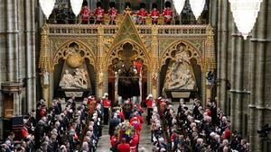 The coffin of Britain's Queen Elizabeth II is carried into Westminster Abbey ahead of her State Funeral, in London, Monday Sept. 19, 2022. The Queen, who died aged 96 on Sept. 8, will be buried at Windsor alongside her late husband, Prince Philip, who died last year. (Danny Lawson/Pool Photo via AP)